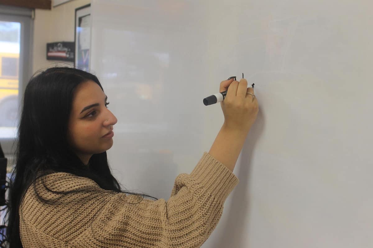 Ms. Forman teaching Global History to 10th-grade students.