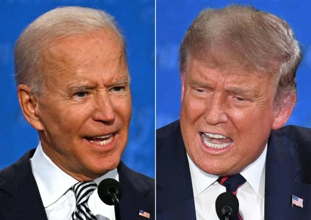 TOPSHOT - (COMBO) This combination of pictures created on September 29, 2020 shows Democratic Presidential candidate and former US Vice President Joe Biden (L) and US President Donald Trump speaking during the first presidential debate at the Case Western Reserve University and Cleveland Clinic in Cleveland, Ohio on September 29, 2020. (Photos by JIM WATSON and SAUL LOEB / AFP) (Photo by JIM WATSON,SAUL LOEB/AFP via Getty Images)