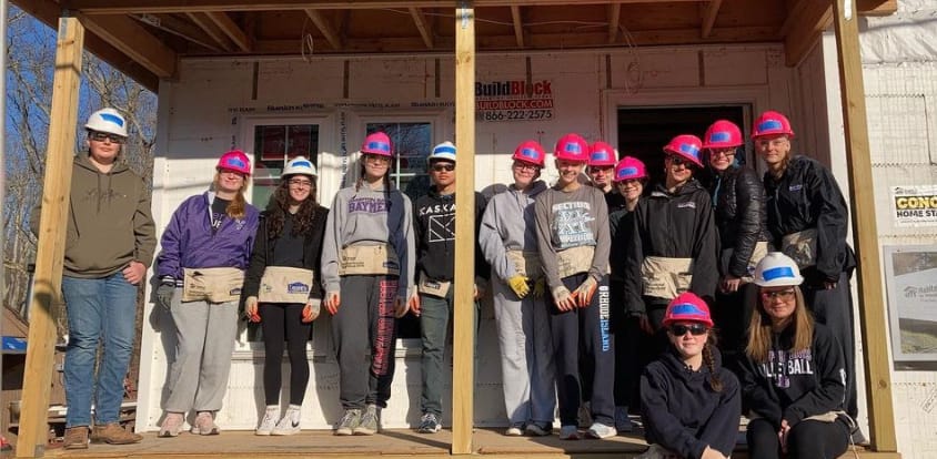 A team of Interact Club members from Hampton Bays High School in front of one of their Habitat For Humanity builds.
Photo credit: Nicole Mahoney